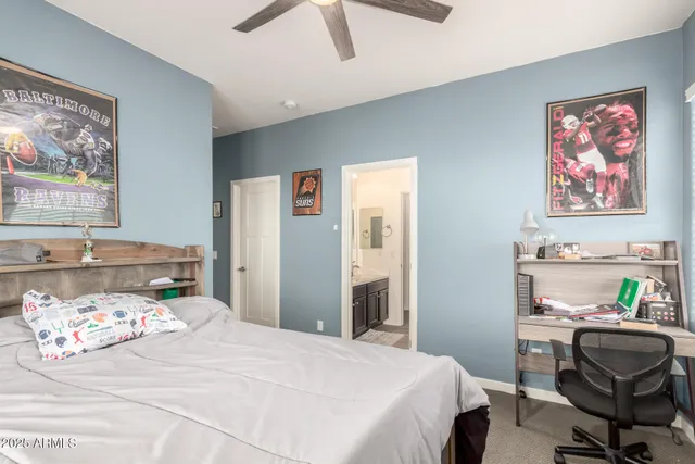 a bedroom with a bed and a chair