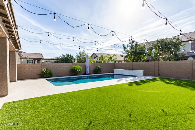 a view of a backyard with potted plants