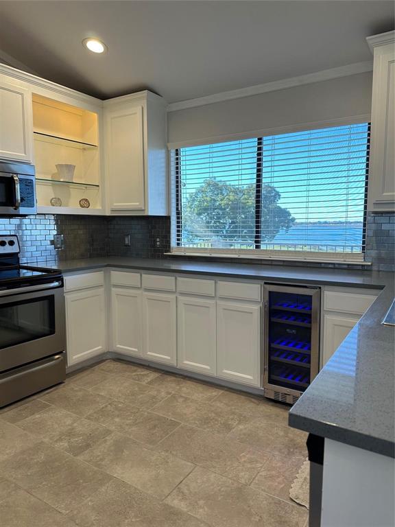 1882 Signal Ridge Place, Unit 1882 Rockwall, TX 75032 - Photo 7 of 19 a kitchen with stainless steel appliances granite countertop a stove and a sink