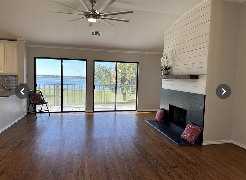 1882 Signal Ridge Place, Unit 1882 Rockwall, TX 75032 - Photo 10 of 19 a living room with furniture and a fireplace