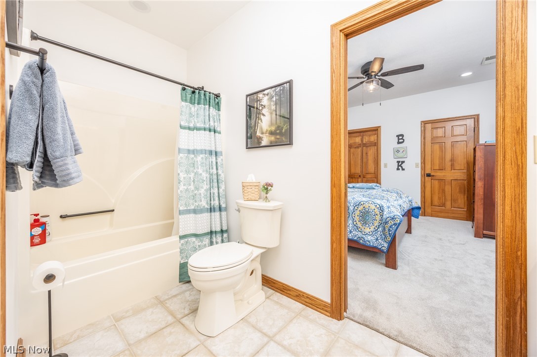 1602 Glendale Road, Unit 3 Marietta, OH 45750 - Photo 28 of 49 Jack and Jill bathroom featuring a white tub/shower combination, toilet, and tile flooring
