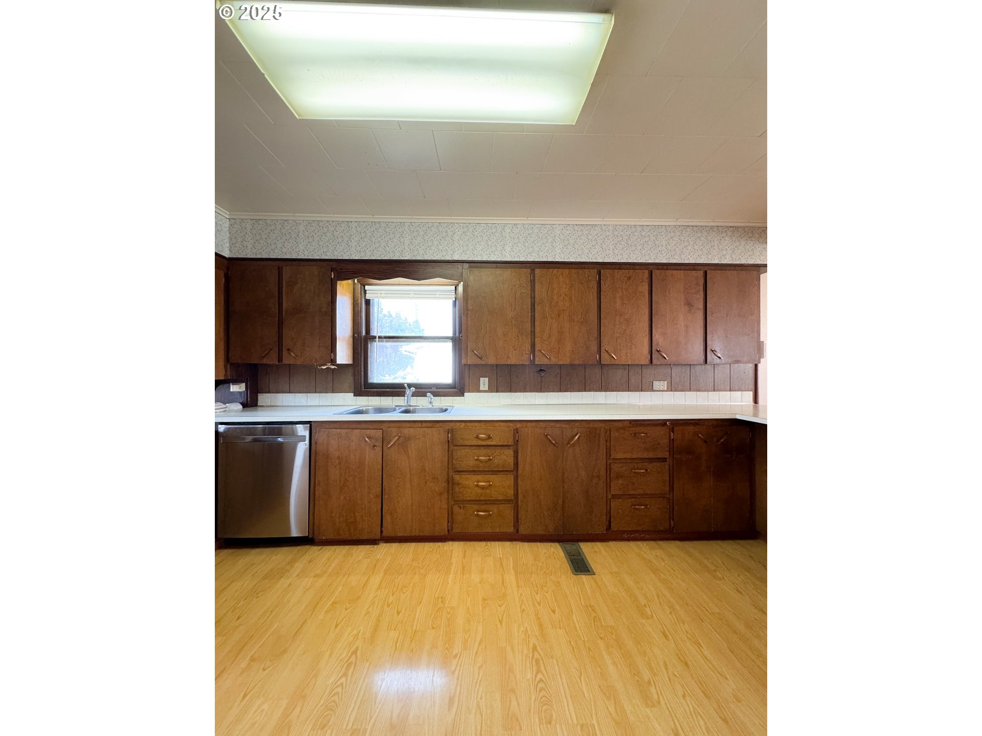 1050 Elm Street Baker City, OR 97814 - Photo 6 of 28 a large kitchen with granite countertop a sink and cabinets