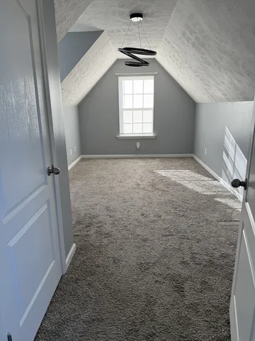 a view of empty room with windows