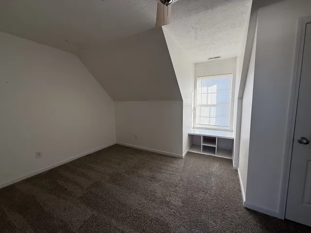 a view of empty room with windows