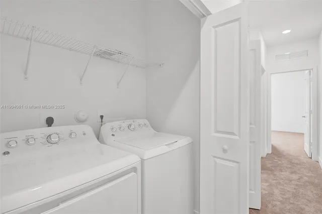 a view of utility room with washer and dryer