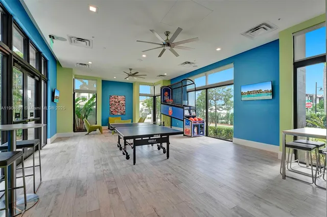a living room with furniture a rug and a window