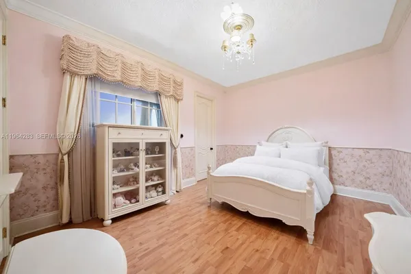 a bedroom with a bed and a desk