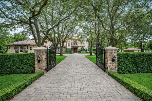 a front view of house with yard and green space