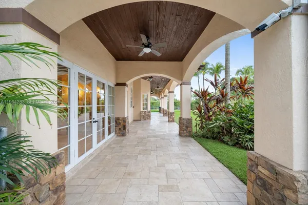 a view of a swimming pool with a patio
