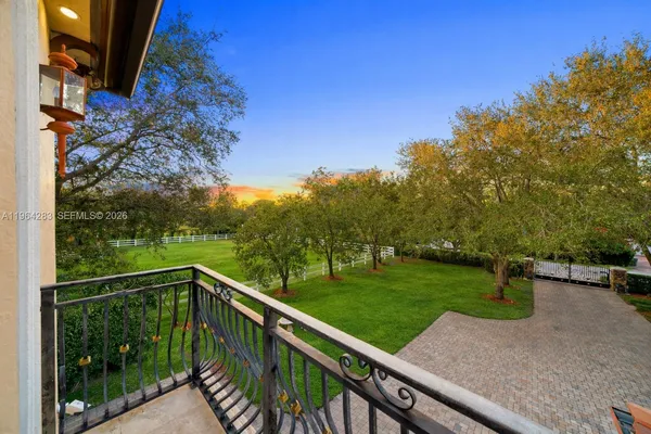a view of a wooden deck with a yard