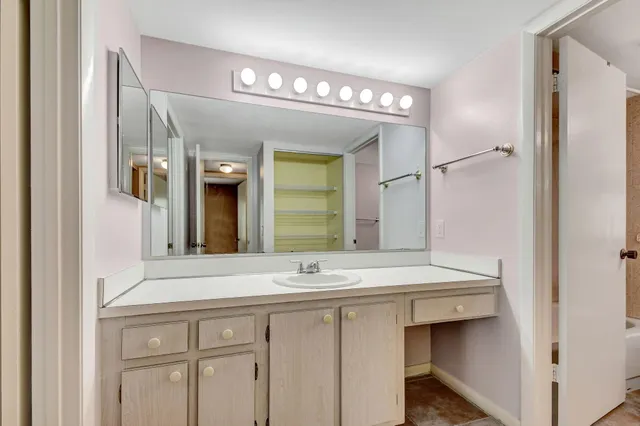 a front view of house with yard and trees