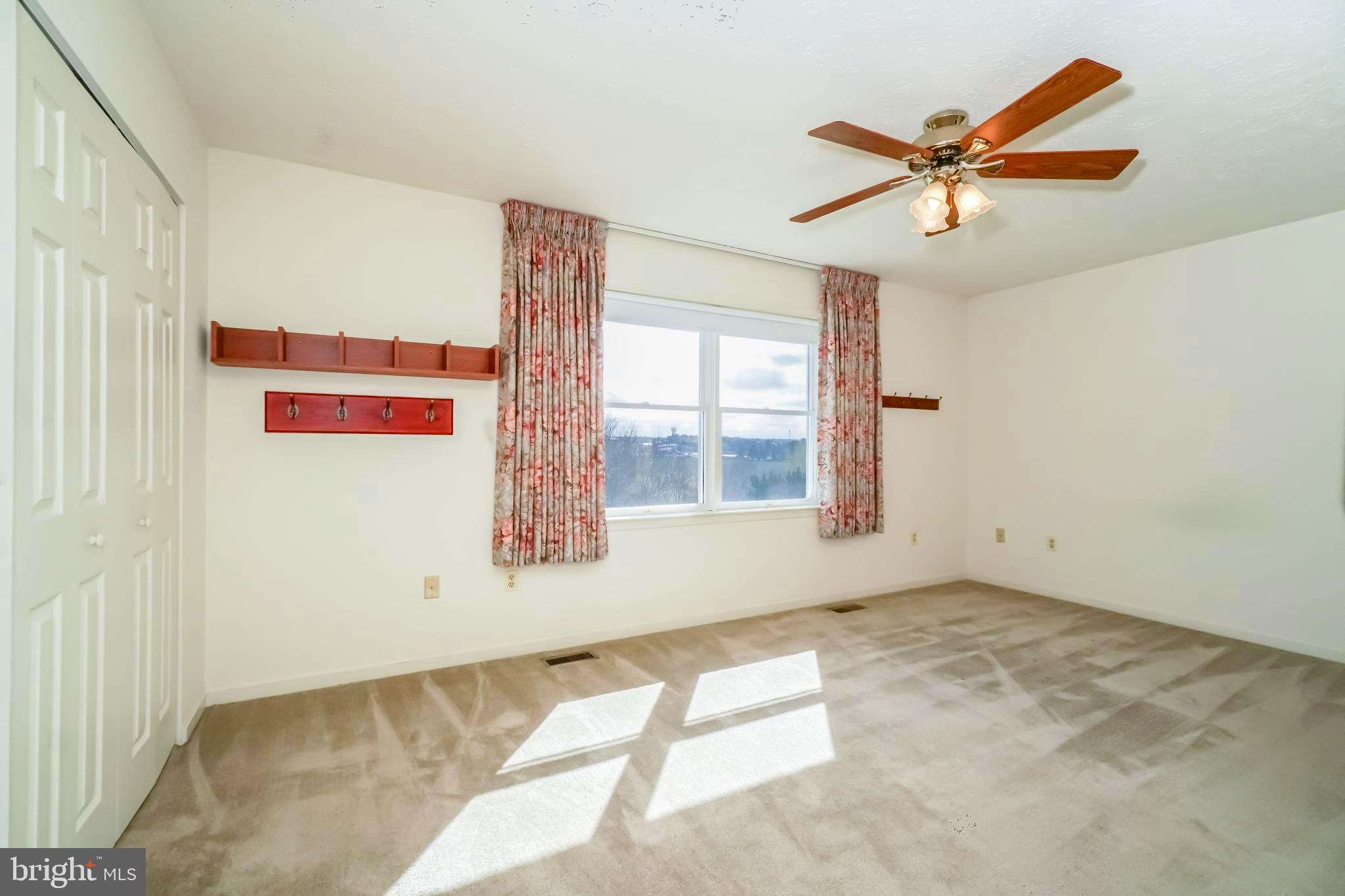 112 Turtleback Court Rising Sun, MD 21911 - Photo 12 of 23 a view of a livingroom with a ceiling fan and window