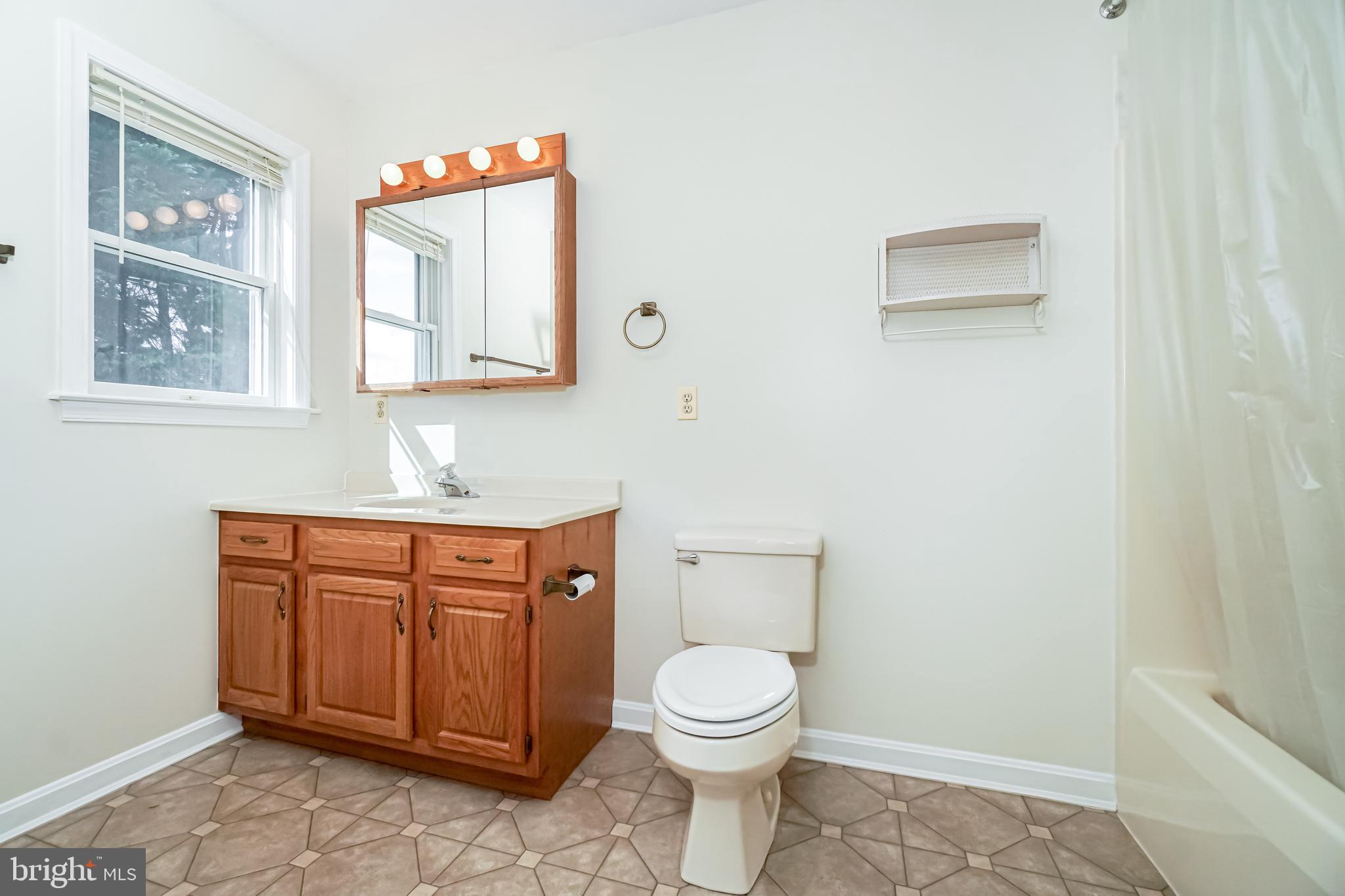 112 Turtleback Court Rising Sun, MD 21911 - Photo 13 of 23 a bathroom with a toilet a sink a vanity and mirror