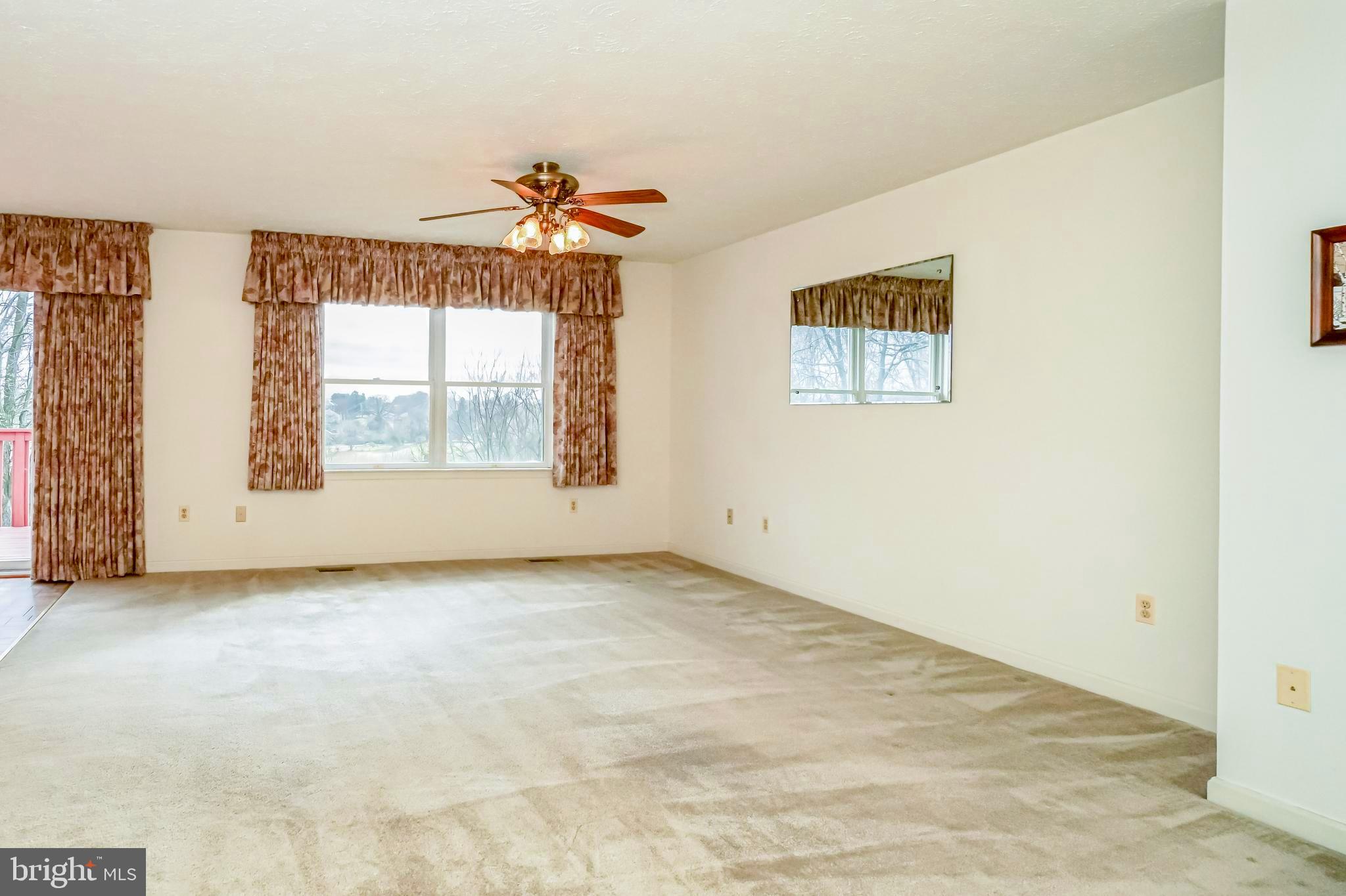 112 Turtleback Court Rising Sun, MD 21911 - Photo 4 of 23 an empty room with windows and fan