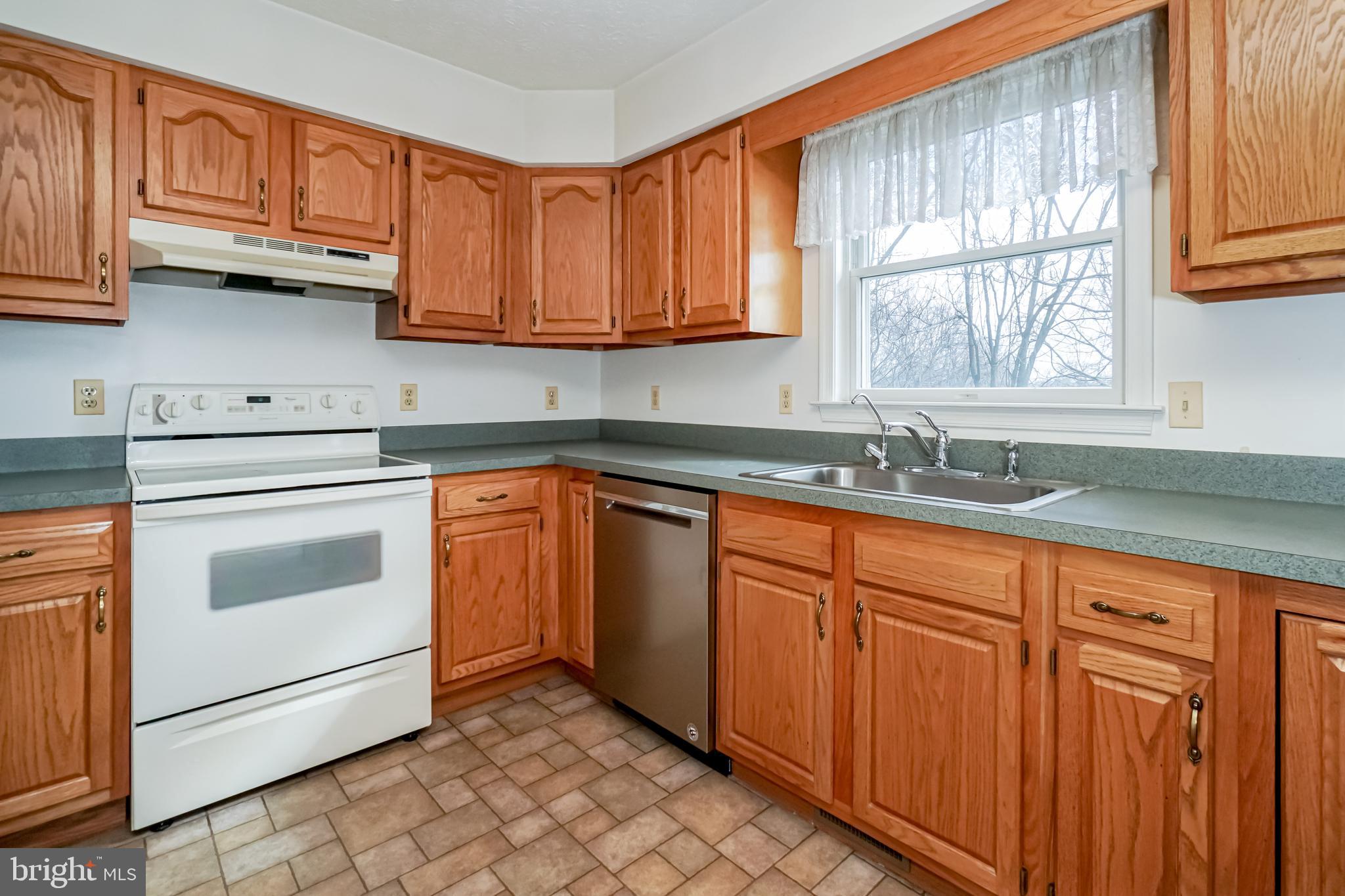 112 Turtleback Court Rising Sun, MD 21911 - Photo 6 of 23 a kitchen with granite countertop cabinets stainless steel appliances a sink and window