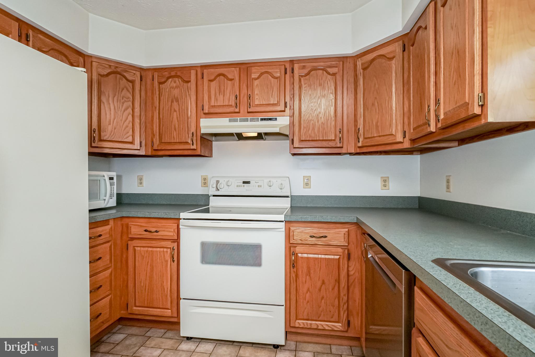 112 Turtleback Court Rising Sun, MD 21911 - Photo 7 of 23 a kitchen with stainless steel appliances granite countertop a sink and cabinets