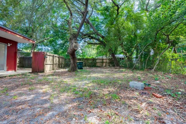 a backyard of a house with lots of green space