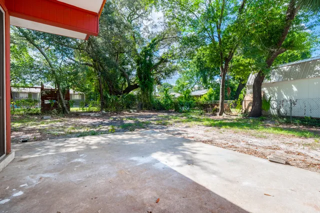 a backyard of a house with lots of green space