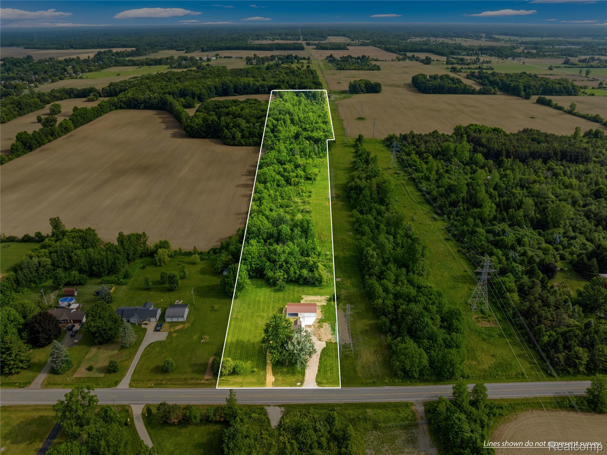 3241 East Frances Road Clio, MI 48420 - Photo 3 of 32 Aerial perspective showcasing a substantial land parcel with a single-story residence