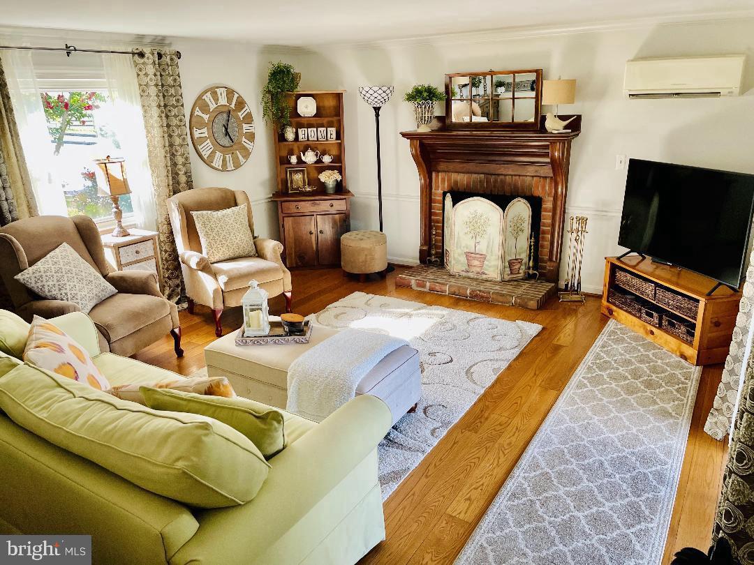 17648 Canby Road Leesburg, VA 20175 - Photo 5 of 12 a living room with furniture and a fireplace