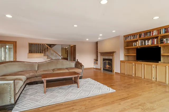 a view of a house with garden and a lake view