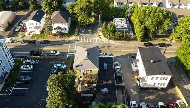 an aerial view of a residential apartment building with outdoor space