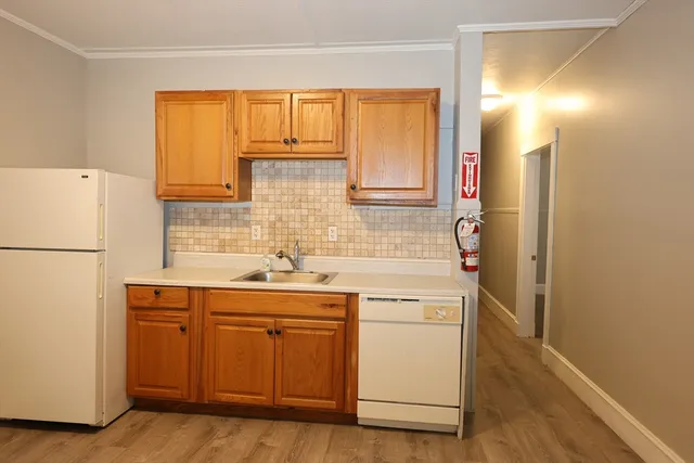 a kitchen with a sink and cabinets