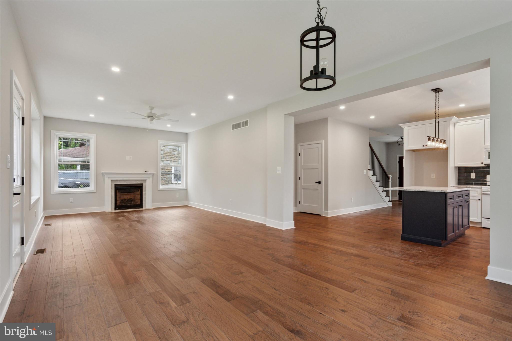 721 Walden Road Cheltenham, PA 19012 - Photo 12 of 25 a view of empty room with wooden floor and kitchen