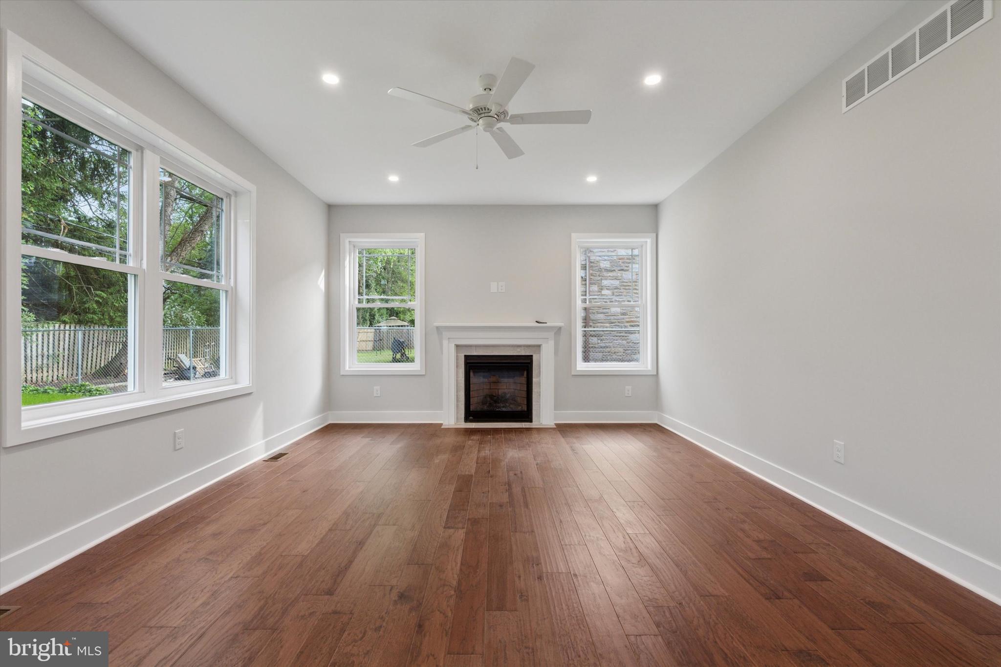 721 Walden Road Cheltenham, PA 19012 - Photo 13 of 25 a view of an empty room with wooden floor and a window