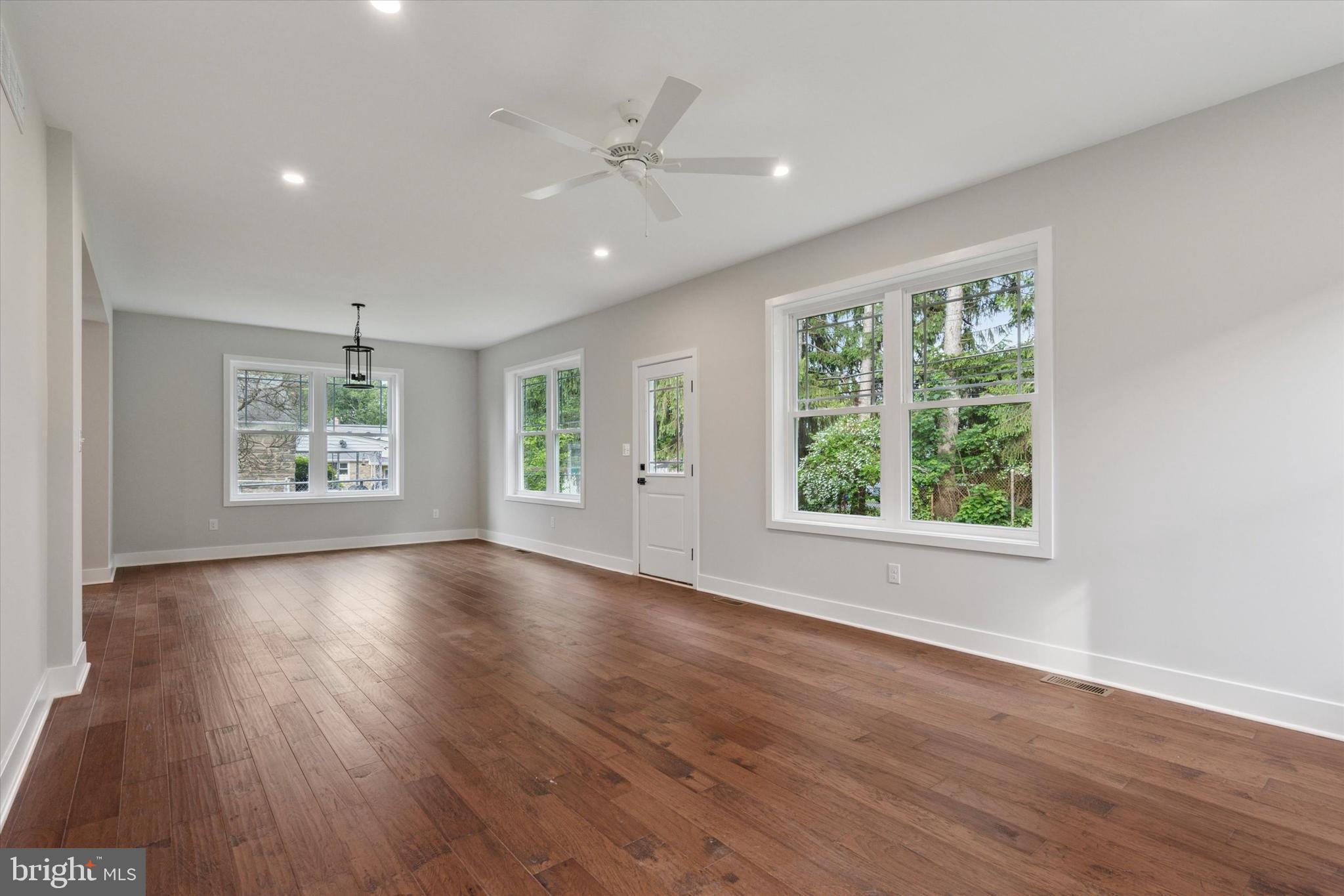 721 Walden Road Cheltenham, PA 19012 - Photo 14 of 25 a view of an empty room with wooden floor and a window
