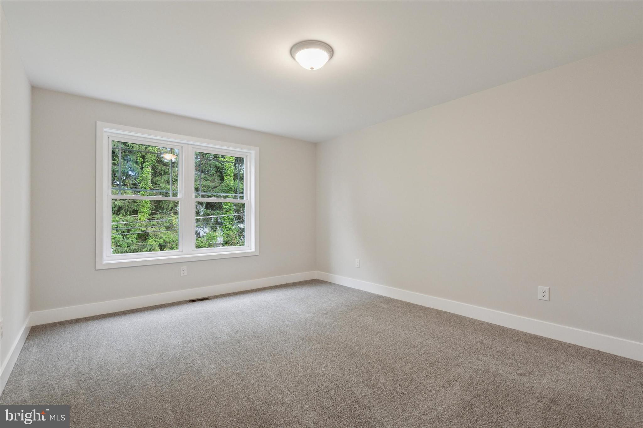 721 Walden Road Cheltenham, PA 19012 - Photo 15 of 25 an empty room with a window