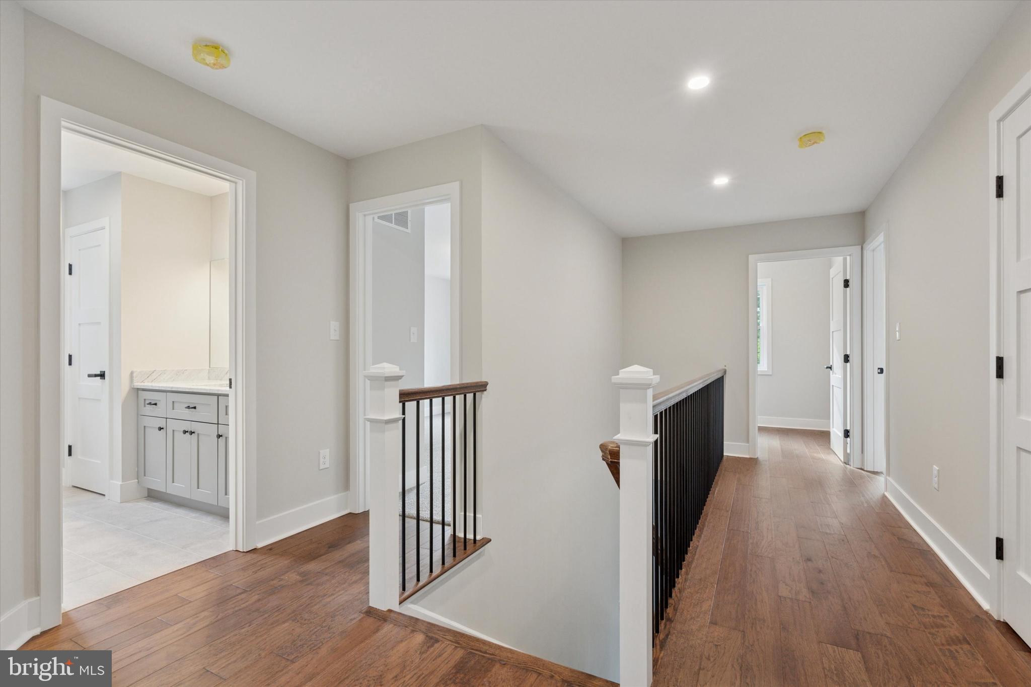 721 Walden Road Cheltenham, PA 19012 - Photo 19 of 25 a view of a hallway with wooden floor and staircase