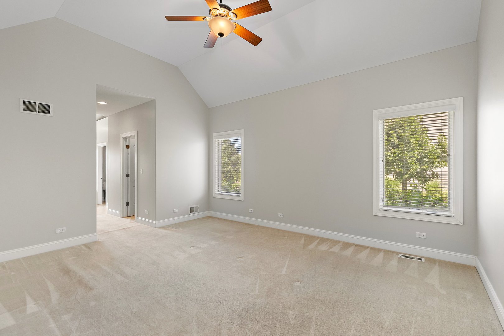 2073 Westover Road North Aurora, IL 60542 - Photo 12 of 24 an empty room with windows and fan