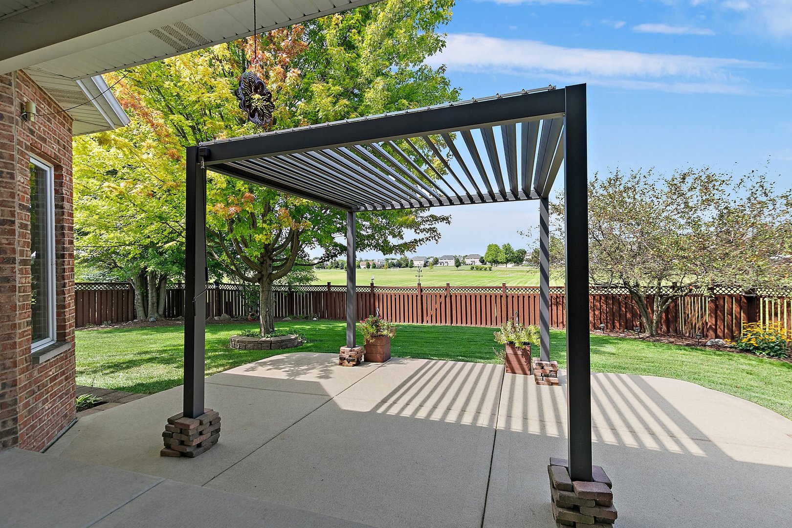 2073 Westover Road North Aurora, IL 60542 - Photo 21 of 24 a view of a deck with a big yard potted plants and large tree