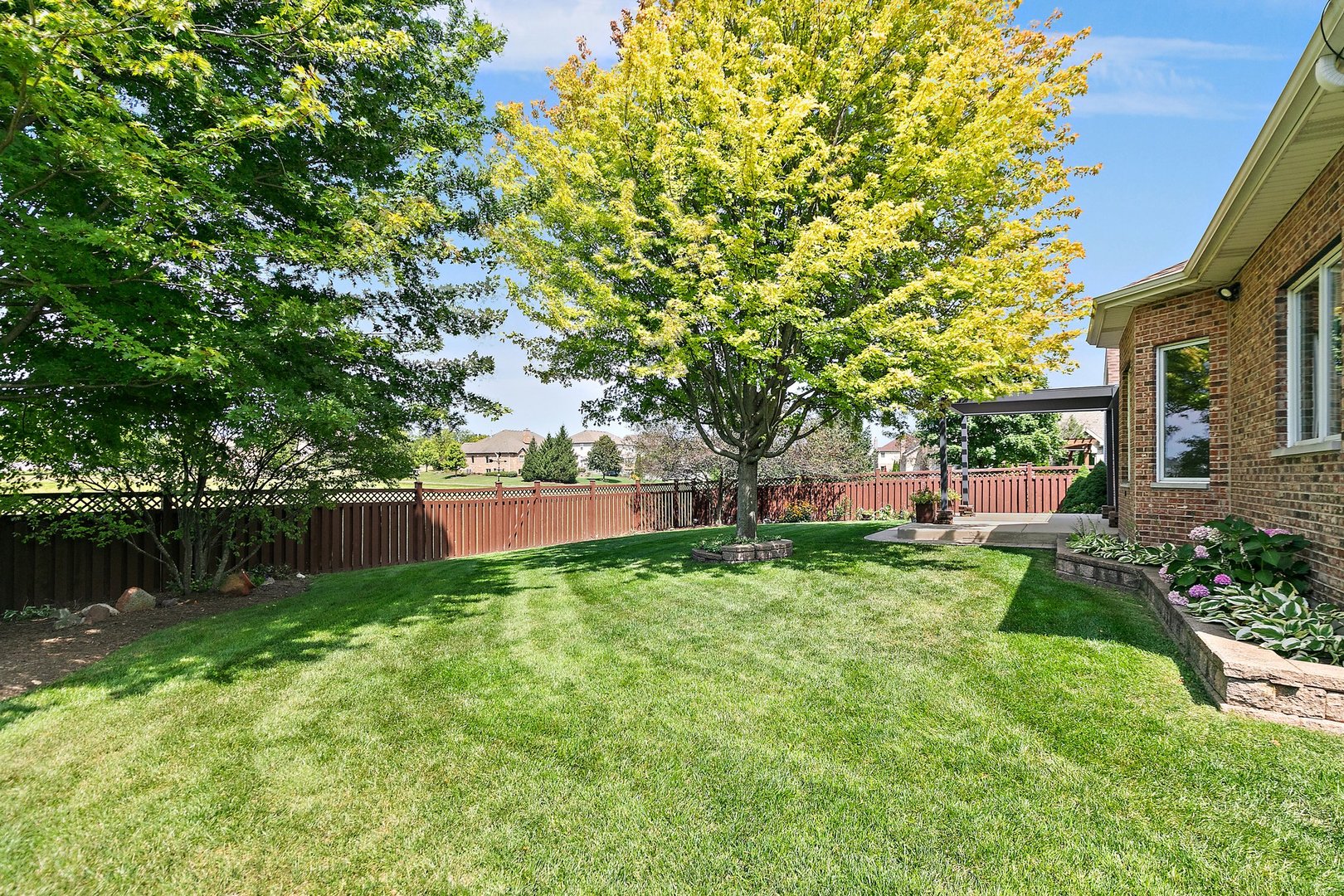 2073 Westover Road North Aurora, IL 60542 - Photo 23 of 24 a backyard of a house with lots of green space