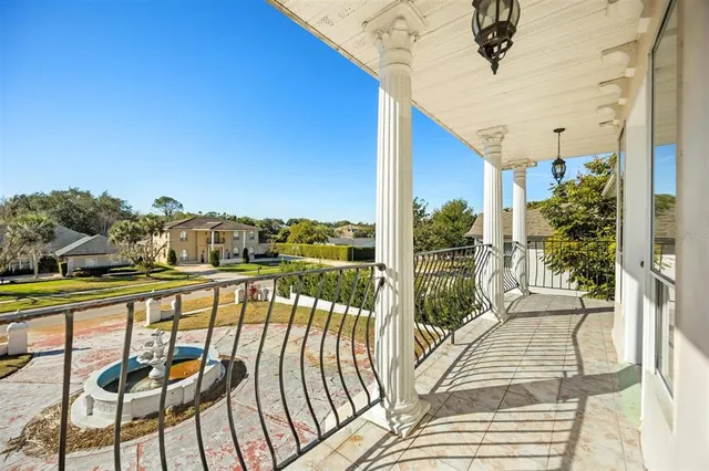 a view of swimming pool with seating area