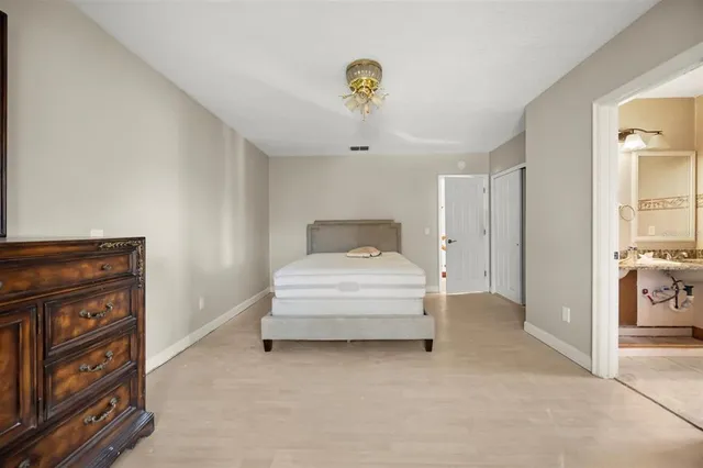 a bedroom with a bed and a cabinets