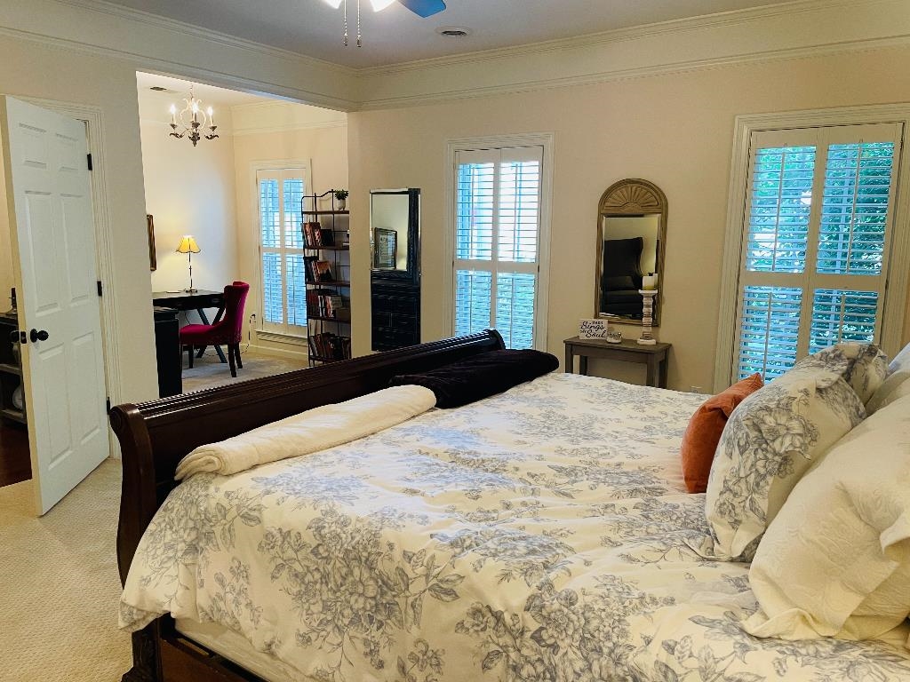 106 Mindy Circle Collierville, TN 38017 - Photo 12 of 25 a bedroom with a bed and a large window