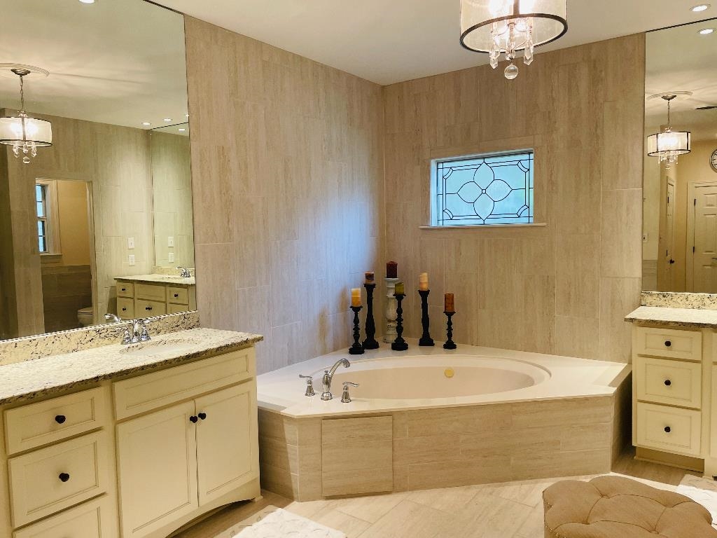 106 Mindy Circle Collierville, TN 38017 - Photo 13 of 25 a bathroom with a tub sink and mirror