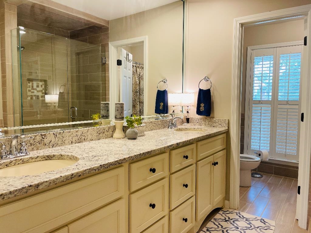 106 Mindy Circle Collierville, TN 38017 - Photo 18 of 25 a bathroom with a granite countertop sink mirror and a toilet