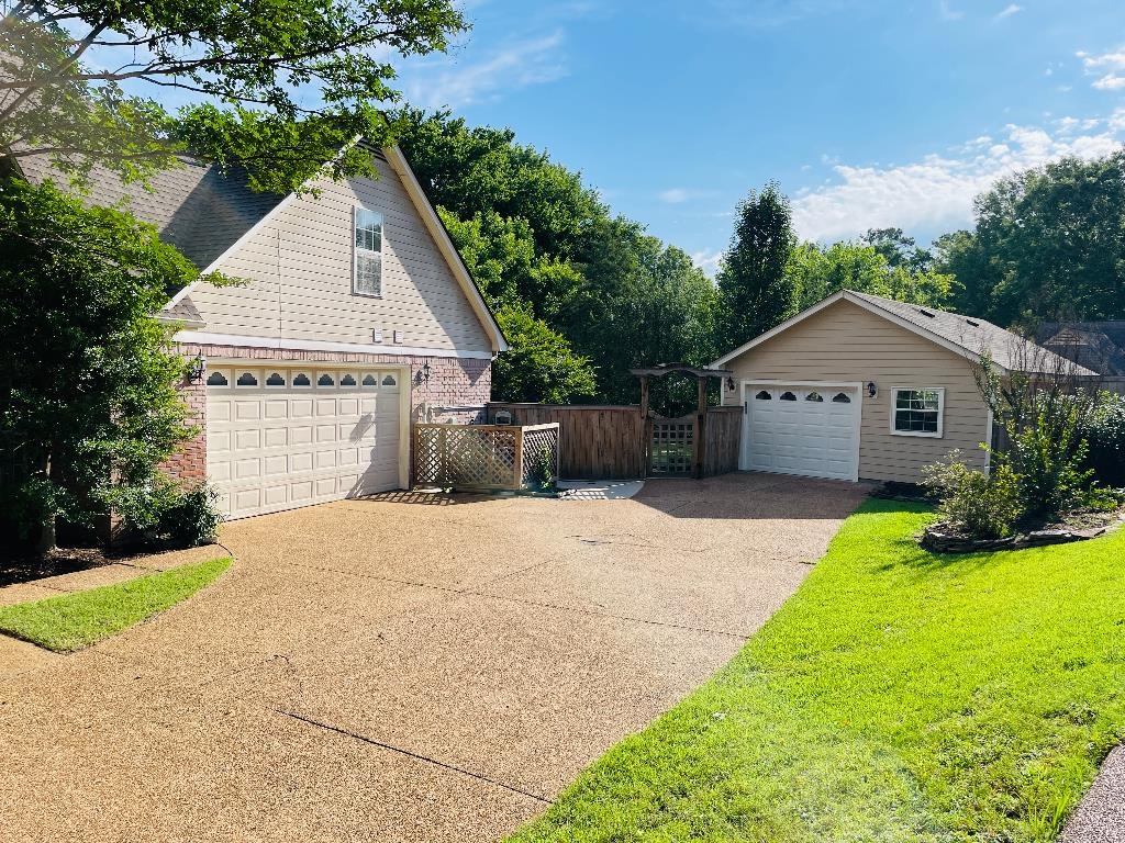 106 Mindy Circle Collierville, TN 38017 - Photo 2 of 25 a front view of house with yard and green space
