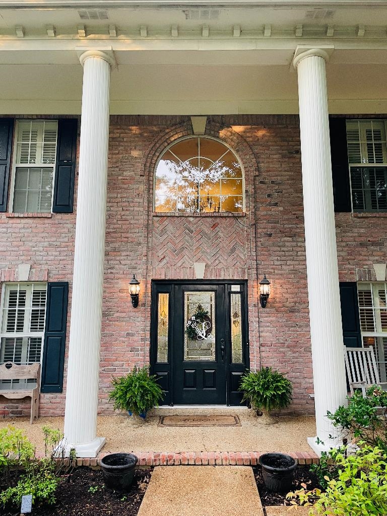 106 Mindy Circle Collierville, TN 38017 - Photo 3 of 25 a front view of a house with garden