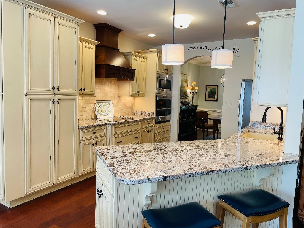 106 Mindy Circle Collierville, TN 38017 - Photo 7 of 25 a kitchen with kitchen island a counter top space a sink stainless steel appliances and cabinets