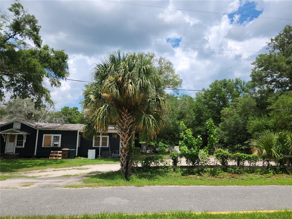 1007 Northeast 25th Street Ocala, FL 34470 - Photo 6 of 9 a front view of a house with a garden