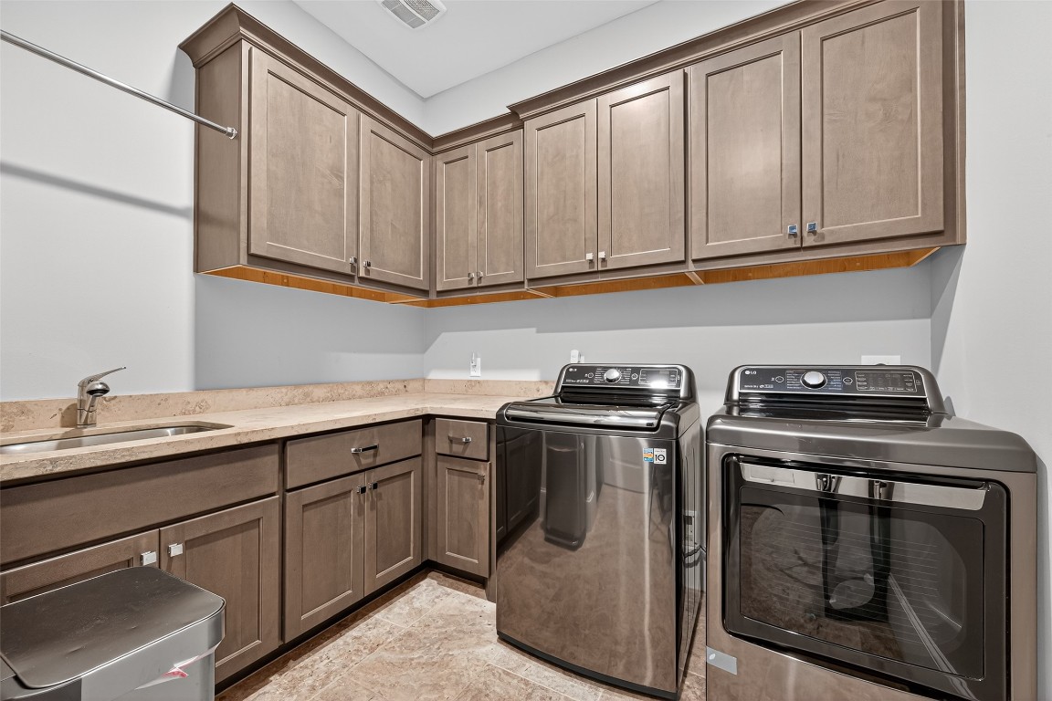 6806 West Warwick Lake Lane Spring, TX 77389 - Photo 21 of 50 Custom cabinets and basin in the washing area for storage