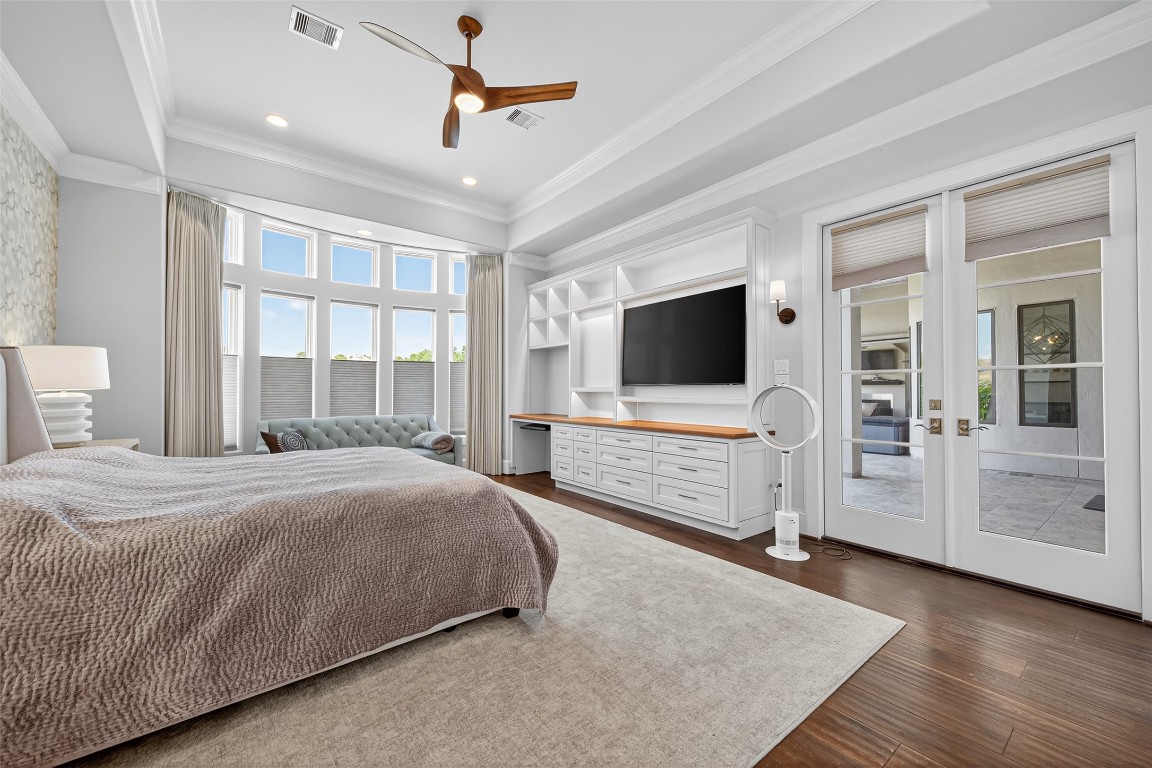 6806 West Warwick Lake Lane Spring, TX 77389 - Photo 36 of 50 Designer custom TV cabinet elevates the whole room. Easy access to patio