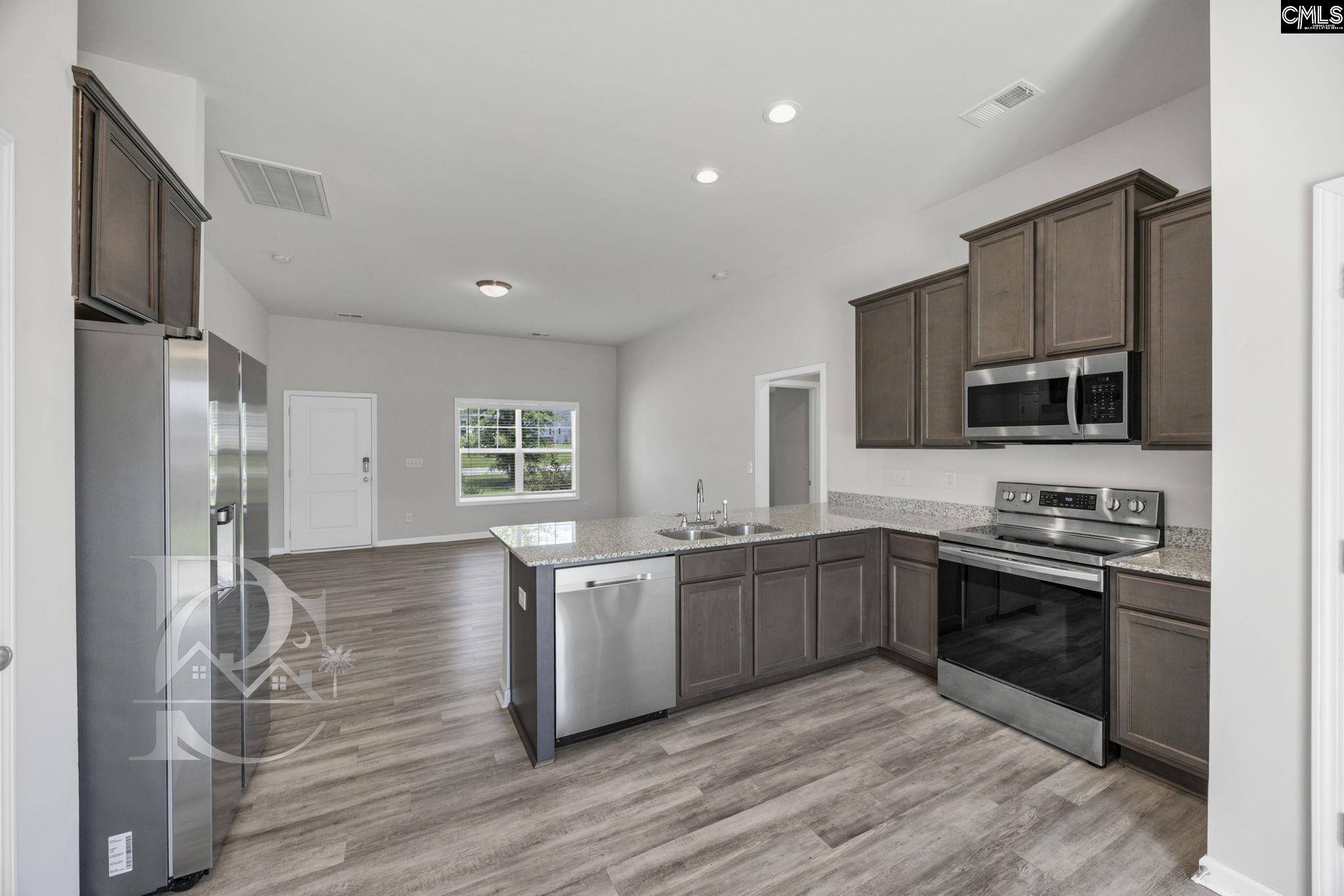 235 Drayton Hall Road West Columbia, SC 29172 - Photo 9 of 24 a kitchen with stainless steel appliances granite countertop a sink stove and refrigerator