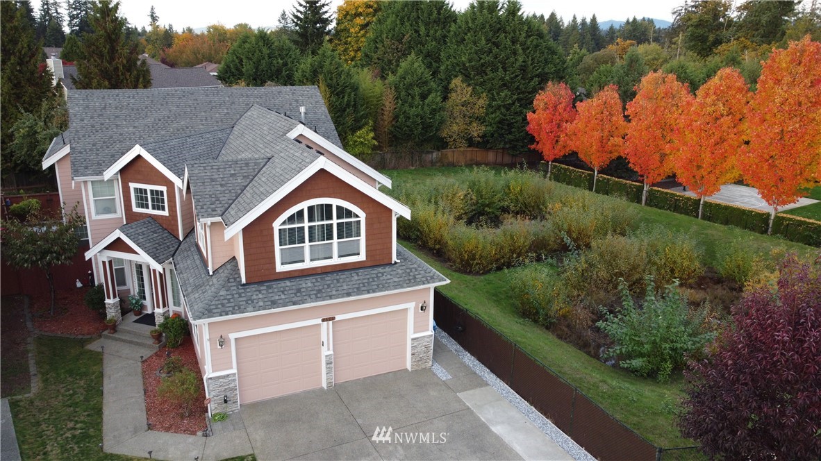 12946 Southeast 216th Place Kent, WA 98031 - Photo 1 of 39 a aerial view of a house with a yard and garage