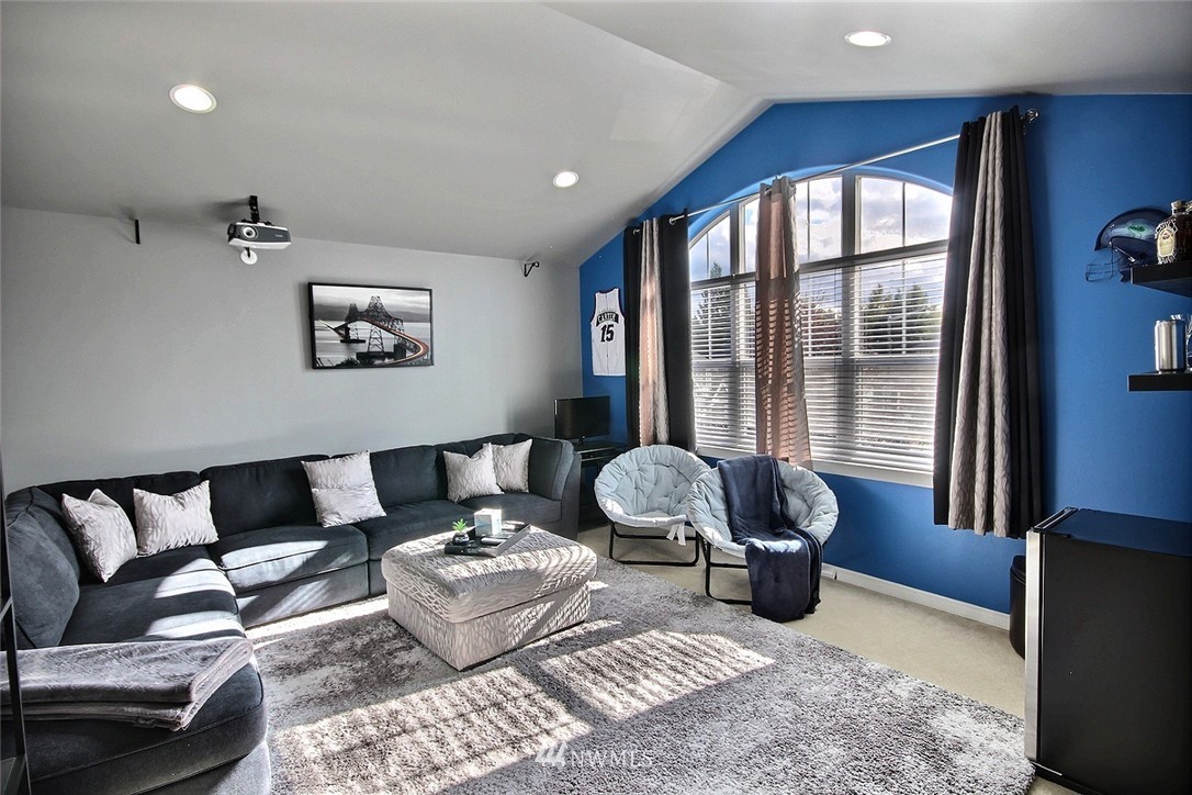 12946 Southeast 216th Place Kent, WA 98031 - Photo 18 of 39 a living room with furniture and a large window