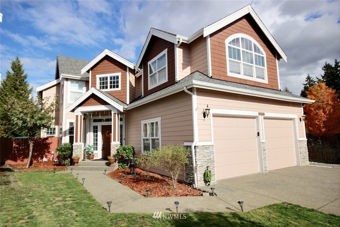 12946 Southeast 216th Place Kent, WA 98031 - Photo 2 of 39 a front view of a house with a yard